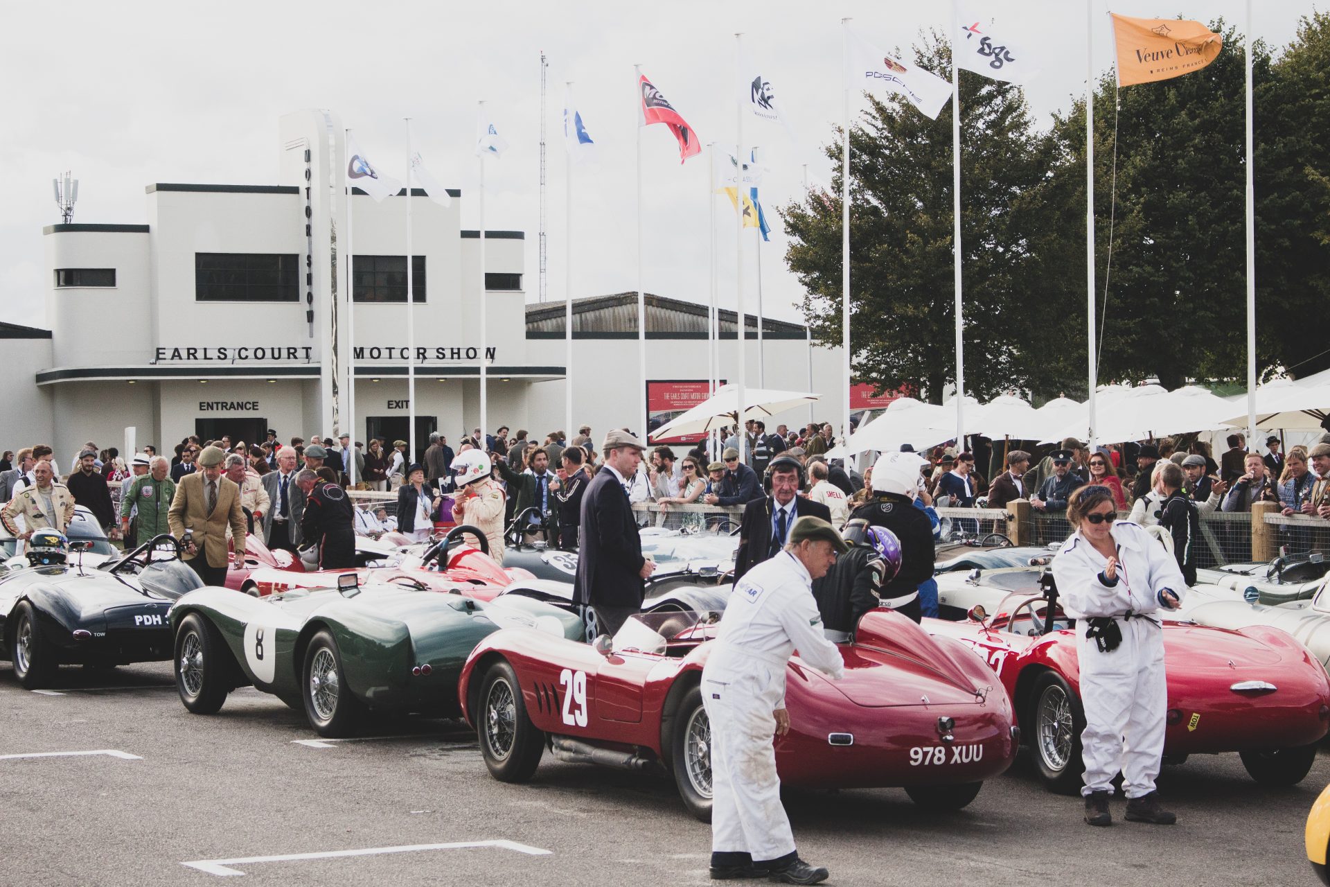 A photo of the Goodwood Revival Sussex Trophy Race Grid with 3 classic race cars in view. The event was attended by our classic car finance team.