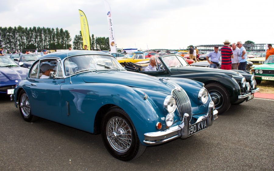 A bright blue Jaguar XK120 at the Silverstone Classic 2018 which we attended with our Classic Car Finance Team.