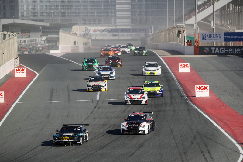 30 race cars driving racing at the start of the Dubai 24 hour Race. Our sponsored driver Angus Fender raced at this event.
